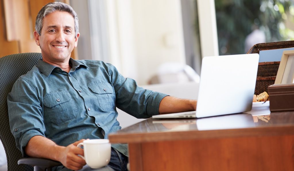 smiling man in home office