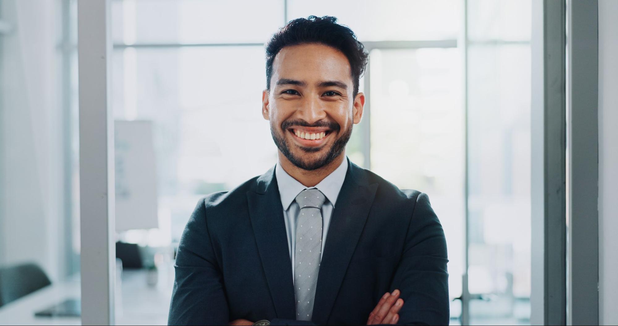 Face, happy professional and confident insurance agent or entrepreneur with arms crossed at work.